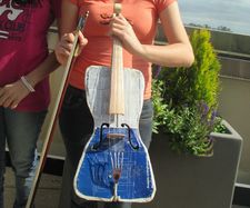 Ada's violin, built by Colá Gomez: "This is the cover of a paint tin can. The back is the underside of a baking tin ..."